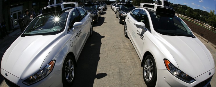 A group of self driving Uber vehicles position themselves to take journalists on rides during a media preview at Uber's Advanced Technologies Center in Pittsburgh, Monday, Sept. 12, 2016. Starting Wednesday morning, Sept. 14, 2016 dozens of self-driving Ford Fusions will pick up riders who opted into a test program with Uber. While the vehicles are loaded with features that allow them to navigate on their own, an Uber engineer will sit in the driver’s seat and seize control if things go awry. (AP Photo/Gene J. Puskar)